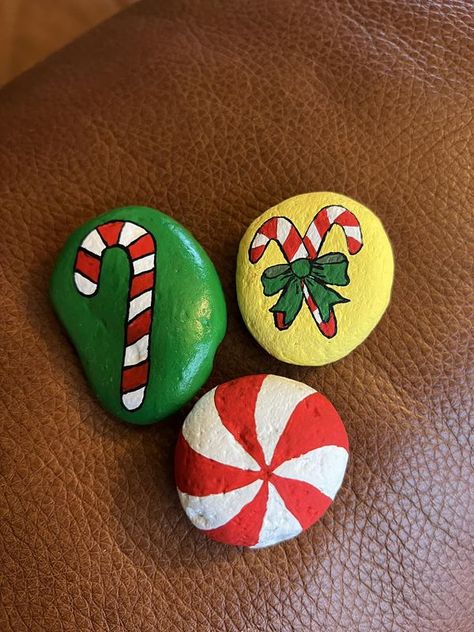 painting rocks! | Day 2 December challenge - Candy canes & a peppermint candy. | Facebook Candy Rocks, December Challenge, Garden Rocks, 2 December, Christmas Rock, Painting Rocks, Rock Ideas, 12 December, Work Activities