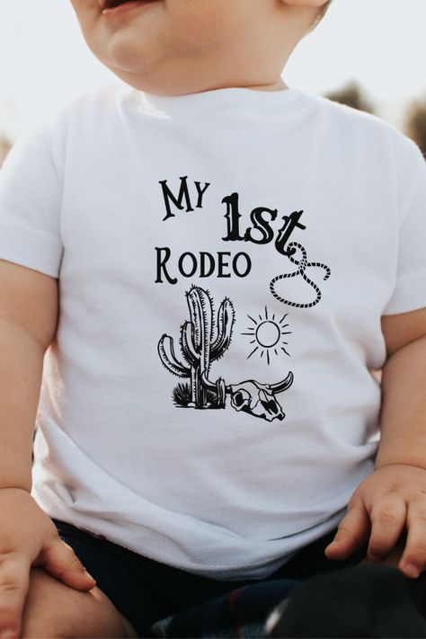 Are you planning a first rodeo theme birthday for your little one? How about this adorable my first rodeo shirt, complete with a cow skull and cactus! My First Rodeo Shirt, First Rodeo Shirt, My First Rodeo Birthday, First Rodeo Birthday, My First Rodeo, Rodeo Birthday, First Rodeo, Rodeo Shirts, A Cow