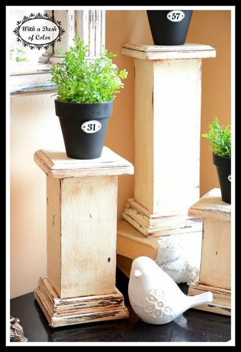 Column Pedestals  Probably less expensive than "plaster/resin" traditional columns at Hobby Lobby, and you can custom-size.  For church, I'd prefer paint, without the "aged" look, in a color that blends with altar wood. These were made from 8ft- 4x4 wood cut into different lengths with a circular saw:  Wooden  Post base trim (found with deck railings and posts).  Square piece of wood for the top of the pedestals.  Church would require much larger sizes:  4 ft, 3 ft, 2ft? Diy Columns, 4x4 Crafts, 4x4 Wood Crafts, Hobby Lobby Furniture, Wooden Posts, Scrap Wood Projects, Wooden Blocks, Diy Wood Projects, Home Sweet Home