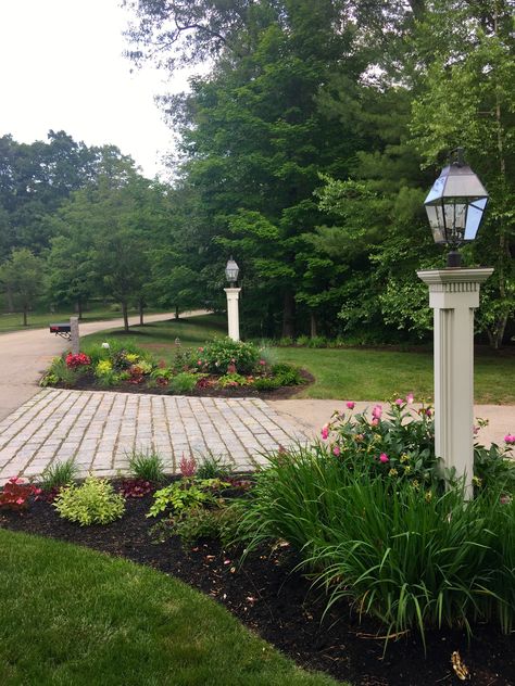 Tree Island Landscape Front Yards, Flower Bed At End Of Driveway, Lake House Flower Bed Ideas, Landscaping At Driveway Entrance, Corner Driveway Landscaping Ideas, Side Of Driveway Landscaping Curb Appeal, Landscaping For Driveway Entrance, Landscape Around Light Post, Driveway Garden Beds