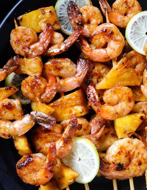 Grilled shrimp skewers with pineapple Shrimp Bbq Recipes Skewers, Seafood Skewers, Shrimp And Pineapple Skewers, Shrimp And Steak Skewers Grill, Shrimp Skewers Grill Pineapple, Tandoori Shrimp, Cajun Grilled Shrimp Skewers, Prawn Skewers, Pineapple Skewer