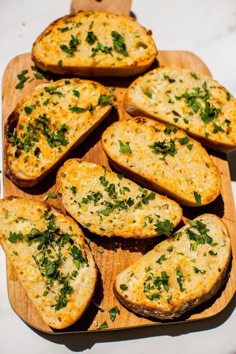 This simple Air Fryer Garlic Bread recipe is the easiest way to whip up a cheesy, buttery, toasty slice of bread to enjoy alongside your dinner! All you need is a french loaf of bread, and then you probably already have the rest of the simple ingredients in your kitchen! Enjoy this garlic bread with a serving of pasta, a hearty bowl of salad, or just as a snack because it’s that dang good! French Garlic Bread, Air Fryer Garlic Bread, Brunch Sweets, Garlic Butter Spread, Spicy Sausage Pasta, French Loaf, Air Fryer Garlic, Cinnamon Banana Bread, Cheddar Cornbread