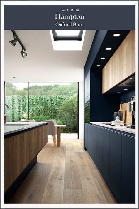 Dark kitchens are all about the drama and this dark blue combination with a wood effect textured finish is the epitome of modern kitchen design. Masterclass Kitchens distribute kitchens across to independent retailers across England, Wales and Scotland Dark Blue Combination, Dark Blue Kitchen, Navy Kitchen Cabinets, Kitchen Cabinets And Flooring, Dark Blue Kitchens, Modern Black Kitchen, Navy Blue Kitchen, Navy Kitchen, Handleless Kitchen