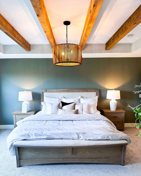 Wooden beams are one of our favorite details to add to your ceilings. It brings warmth and a cozy, cabin-like design to this bedroom we saw with @paradeofhomestc. Would you add this to your bedroom? . . . . . #MinneapolisRemodel #HomeRenovation #TwinCitiesRemodel #TwinCitiesHome #MinneapolisHome #MinneapolisArchitecture #MinneapolisDesign #HomeRenovation #MinneapolisContractor #MidwestHome #MidwestLiving #ArtfulLiving #MNDesignBuild #TwinCitiesHomes #TwinCities #Minnesota #MNLiving #Minneso... Bedroom With Wooden Beams, Wooden Beams Ceiling Bedroom, Beams Bedroom Ceiling, Beams Ceiling Bedroom, Beams Bedroom, Beams Ceiling, Wooden Beams Ceiling, West Home, Midwest Living