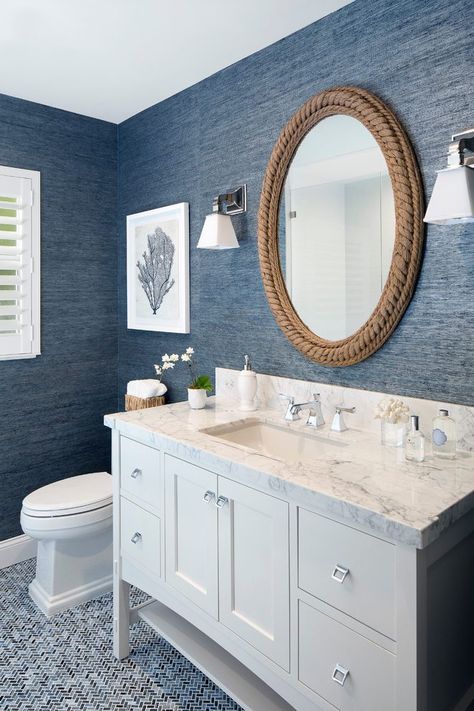 Denim blue wall paper and flooring in an updated bathroom #becolorfulcoastal #coloroftheweek #denimblues #bluebathroom Blue White Bathrooms, Navy Blue Bathrooms, Coastal Bathroom Decor, Navy Bathroom, Beach House Bathroom, White Bathroom Decor, Decorating Bathroom, Nautical Bathrooms, Small Remodel