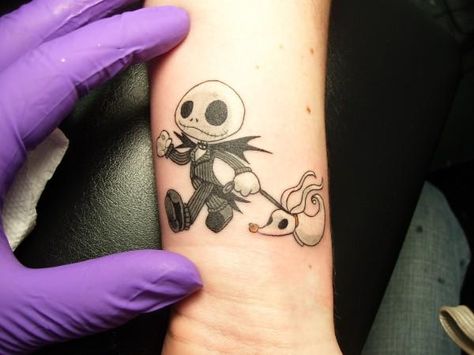 little jack skellington & other jack Skellington tattoos... i wouldn't ever get it, but I like the little Jack! lol Jack Skeleton Tattoo, Skellington Tattoo, Lilies Tattoo, Jack Skellington Tattoo, Jack Tattoo, Nightmare Before Christmas Tattoo, Petit Tattoo, Christmas Tattoo, Skeleton Tattoos