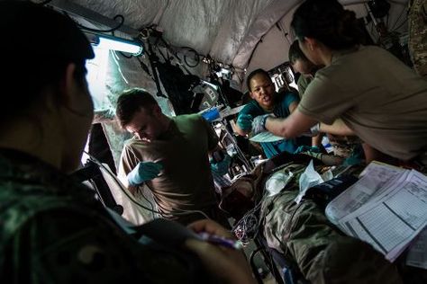 Emergency room doctors and medics work on a patient during a mass casualty scenario at the 121st Combat Support Hospital at Camp Humphreys, South Korea, Friday, April 20, 2018. (Marcus Fichtl/Stars and Stripes) #deployment #deployed #militarydoctors #usmilitary #military #USArmy #Army #soldiers Military Camp In Syria, Military Doctor, Army Doctor, Night Duty, Pictures Of Soldiers, Emergency Room Doctor, Field Hospital, Military Camp, Army Tent