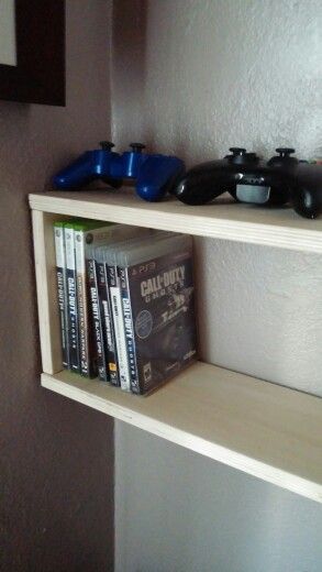 DIY video game and DVD shelf Diy Video Game Storage, Video Game Organization Ideas, Video Game Storage Ideas, Video Game Shelf, Games Storage, Dvd Shelf, Video Game Organization, Video Game Storage, Diy Video Game