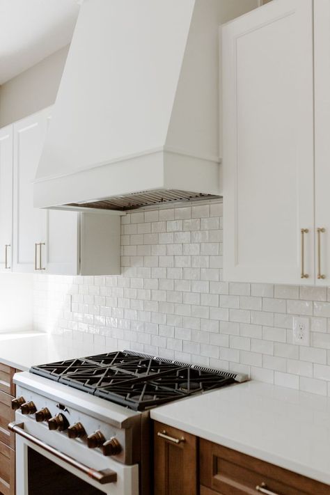 Two toned kitchen custom hood vent and shelving. white subway tile backsplash. #kitchens #kitchendesign #kitchen #interiordesign #design #kitchendecor #kitcheninspo #kitchenrenovation #kitchensofinstagram #kitchenremodel #interior #kitchenideas #kitcheninspiration #customhoodvent #twotonedkitchen Slanted Range Hood, Wood Oven Range Hood, High Ceiling Range Hood Ideas, Shaker Kitchen Hood, Tapered Range Hood, Transitional Range Hood, Kitchen Custom Hood, Kitchen Hood Vent Cover, Range Hood With White Cabinets