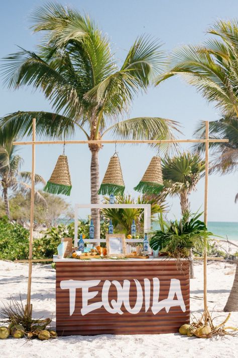 tequila bar, beach wedding, wedding reception, beach wedding decor, wedding inspiration, beach reception ideas, tropical wedding, wedding bar, seaside wedding, coastal wedding, wedding drinks, tequila wedding bar, wedding design, beach party, wedding celebration, romantic island wedding decor, elegant tropical wedding receptions, al fresco wedding tablescapes, breezy wedding table designs, island getaway wedding themes, relaxed beach wedding tablescapes, Tequila Bar Decor, Tequila Bar Ideas, Beach Reception Ideas, Island Wedding Decor, Tequila Wedding, Relaxed Beach Wedding, Beach Theme Wedding Reception, Beach Cocktail Party, Surfer Wedding