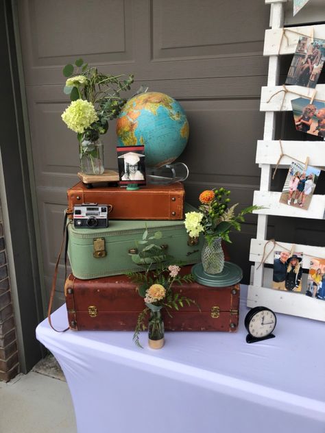 Travel Theme Graduation Party, Travel Agent Booth Ideas, Agent Booth, Vintage Themed Party, Travel Centerpieces, Pioneer Meeting, Adventure Party Theme, Vintage Graduation Party, Travel Theme Party