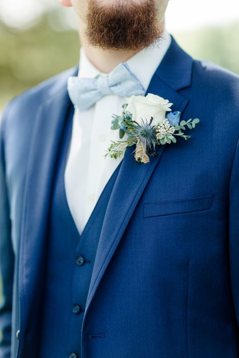 Dusty Blue & Navy Groom's Attire Navy Groom Tuxedo Wedding, Navy Blue Tux With Dusty Blue Tie, Navy Suit With Dusty Blue Tie, Navy Blue And Dusty Blue Groomsmen, Navy Suit With Blue Tie, Blue Suit With Bow Tie Wedding, Groom Suits For Wedding Blue, Dusty Blue Suit Groom, Navy Suit Blue Tie