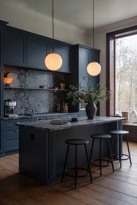 A sophisticated dark blue kitchen with a large island, marble countertops, wood flooring, and circular pendant lights adding a warm glow Moody Kitchen Ideas, Moody Kitchens, Modern Dark Kitchen, Dark Kitchen Countertops, Dark Blue Kitchen, Blue Countertops, Island Marble, Dark Blue Kitchens, Kitchen Vibes