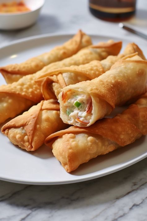 Dive into a sea of flavors with our Crab Rangoon Egg Rolls Recipe. Creamy crabmeat and cheese wrapped in crispy perfection! Try it today and savor the magic. Crab Rangoon Egg Rolls, Egg Rolls Recipe, Cheese Wrap, Crab Rangoon, Egg Roll Recipes, Crab Meat, Egg Rolls, Spring Rolls, Rolls Recipe