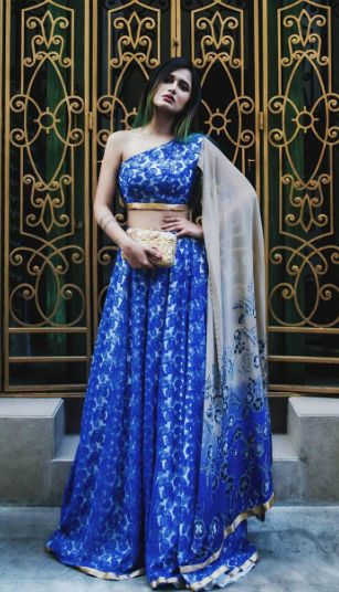 One shoulder blouse with an attached dupatta and a matching lehenga. The blogger Nidhi Kunder is rocking in this look!  #oneshoulder #letstalktrend #trends #ss17 #indian Lehenga Blouse With Attached Dupatta, One Shoulder Blouse With Attached Dupatta, One Shoulder Lengha Blouse, Tube Blouse Lehenga, Dupatta Attached To Blouse, One Shoulder Saree Blouse, One Shoulder Blouse Lehenga, Blouse With Attached Dupatta, One Shoulder Lehenga