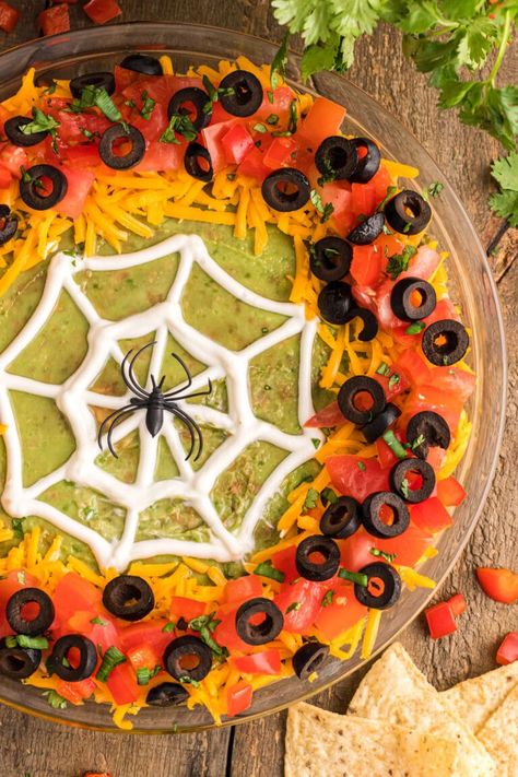 This spiderweb taco dip is layered with refried beans, a mixture of cream cheese, sour cream, and taco seasoning, then topped with guacamole, a creepy piped web, and lots of taco dip fixins. Spider Web Taco Dip, Halloween Taco Dip, 7 Layer Bean Dip, Halloween Dip, Pineapple Dream Dessert, Layered Bean Dip, Recipe Inspirations, Halloween Party Appetizers, Halloween Food Appetizers