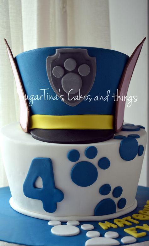 Chase Cake A two level topsy turvy cake!! The hat of the famous dog "Chase" from Paw Patrol!! Chase From Paw Patrol Cake, Chase Cake Paw Patrol, Chase Birthday Cake Paw Patrol, Chase Birthday Cake, Chase Birthday Party, Chase Paw Patrol Cake, Paw Patrol Chase Cake, Chase Cake, Chase From Paw Patrol