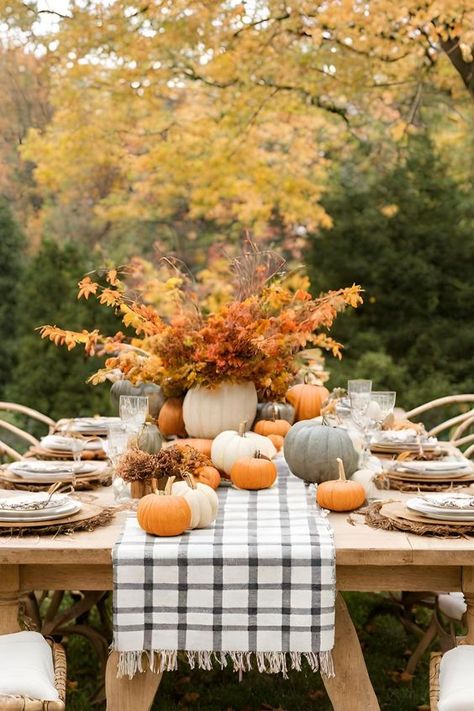 21 Outdoor Fall Decorating Ideas - Outdoor Fall Table Set with Pumpkins and Leaves Outdoor Fall Table Decor Ideas, Fall Outdoor Dining Table Decor, Hosting An Outdoor Fall Party, Outdoor Thanksgiving Tablescapes, Fall Patio Table Decor, Thanksgiving Dinner Outdoors, Fall Outdoor Tablescapes, Fall Themed Party Decor, Thanksgiving Outdoor Decor