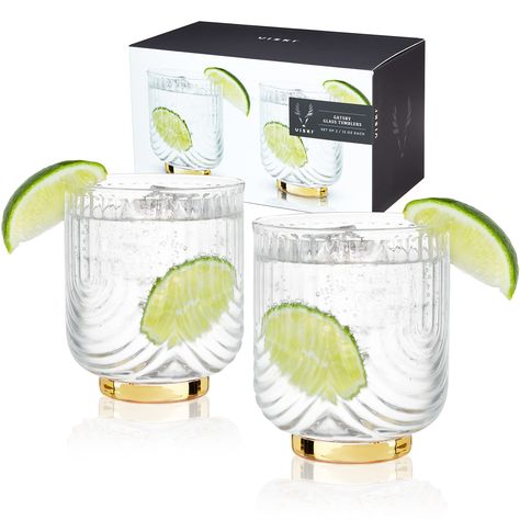 PRICES MAY VARY. STYLISH COCKTAIL TUMBLERS – With their crystal clarity and gold-plated details, these tumblers look great on a bar cart. While they’re perfect for a classic double old fashioned, they give any craft cocktail extra pizazz. HIGH-QUALITY GLASS WITH GOLD ACCENTS – This beautiful crystal-clear glass set is crafted for a high-end sipping experience. Sleek draping glass and a gold-plated foot give this barware timeless elegance—perfect for serving your finest liquor. MADE TO LAST – Vis Christmas Gifts For Parents, Crystal Glassware, Glassware Collection, Drinking Set, Vintage Cocktail, Vintage Barware, Cocktail Glasses, Craft Cocktails, Cocktail Glass