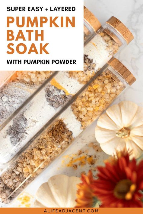 Layered pumpkin spice fall bath soak in bath salt tubes surrounded by decorative mini white pumpkins and red flowers. Text overlay: super easy and layered pumpkin bath soak with pumpkin powder. Diy Pumpkin Spice Latte, Pumpkin Spice Body Butter, Pumpkin Powder, Diy Bath Soak, Bath Soak Recipe, Diy Pumpkin Spice, Bath Salts Recipe, Bath Salts Diy, Powder Milk