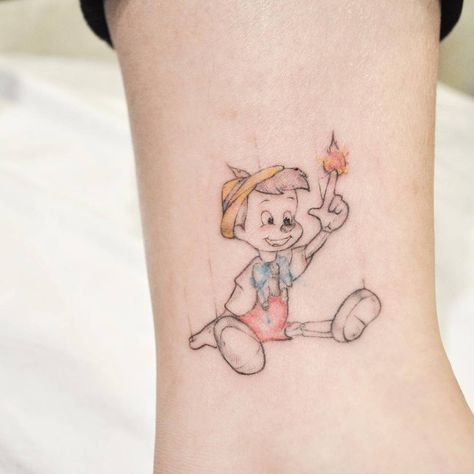 Pinocchio Pinocchio Tattoo Ideas, Pinocchio Tattoo, Ankle Tattoo Men, Dragon Head Tattoo, Ankle Tattoo Designs, Explore Tattoo, Temporary Tattoo Designs, Badass Tattoos, Book Tattoo