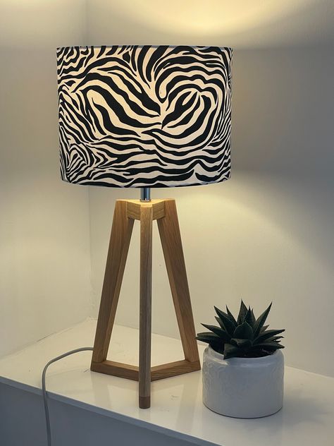 Handmade super kitsch fabric drum lampshade with a zebra print design Colourway: Black and White Sizes available: 20 cm wide x 20 cm high 25 cm wide x 25 cm high 30 cm wide x 22 cm high 35 cm wide x 24 cm high 40 cm wide x 24 cm high Suitable for use with lamp base or with a ceiling pendant As all shades are handmade each one is completely unique. 20 cm - perfect for a bedside table or a small room as a ceiling fix 25 cm - a little in between! Will suit medium lamps and medium sized room as a ce Zebra Bedroom, Zebra Room, Zebra Decor, Red Lamp, Zebra Animal, Future Apartment Decor, Zebra Design, Tropical Home Decor, Lampshade Chandelier