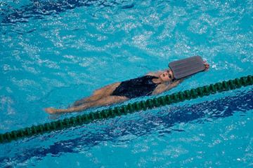 A swimmer swims with a float during a training session in the National Aquatics Center at the Beijing 2008 Olympics in Beijing, on Aug. 7, 2008. Teach Kids To Swim, All Over Body Workout, Swimming Drills, Swim Technique, Swimming Benefits, Swimming Equipment, Swim Coach, Pool Workout, Swimming Quotes