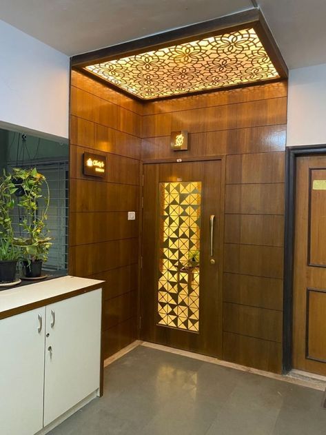 Home Safety Door Design, Bedroom Doors Modern Woods, Entrance Wall Design Front Entry Home, Flats Main Door Design, Main Entrance Wall Design Modern, Flat Enterence Design, Flat Front Door Decor, Main Door Entrance Ceiling Design, Main Door Design Entrance For Flats