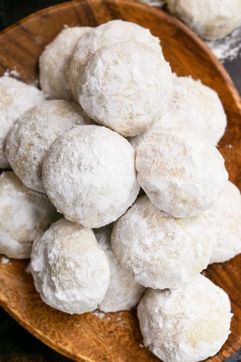 The best, quick and easy snowball cookies recipe (Mexican wedding cookies), homemade with simple ingredients. Rich, buttery, tender, loaded with chopped pecans and powdered sugar. They look like snow and are a classic Christmas cookie that you would find on many holiday dessert tables and platters. They are so easy to make that even kids can help out, just like these Cranberry Orange Cookies (Shortbread) or these Church Window Cookies. What are snowball cookies? They are also known as Mexican Snowball Cookies Recipe Christmas, Holiday Desserts Kids, Snowball Cookies Recipe, Wedding Cookies Recipe, Pecan Snowball Cookies, Cranberry Orange Cookies, Snowball Cookie Recipe, Cookies Wedding, Wedding Cake Cookies