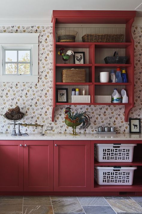 laundry room with red cabinets and built in storage for laundry baskets Orange Laundry Room, Red Laundry Room, Red Cabinets, Red Farmhouse, Farmhouse Laundry, Laundry Design, Farmhouse Laundry Room, Laundry Baskets, Professional Decor