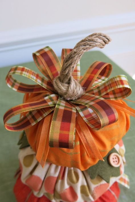 Fall will soon be here and one of my favorite ways to decorate is with fabric pumpkins! Fabric pumpkins are an easy, multi-use decoration for Halloween and Thanksgiving. These pumpkins can be purchased in a number of colors and designs, but can be expensive to buy. However, you can easily make them yourself, then embellish them and use them to create your own stacked pumpkin topiary. Materials and Tools These pumpkins require minimal sewing skills and are a great project for using… Stacked Pumpkin Topiary, Decoration For Halloween, Pumpkin Topiary, Fall Mantle, Pumpkin Bead, Artificial Pumpkins, Ribbon Decorations, Felt Leaves, Stacked Pumpkins