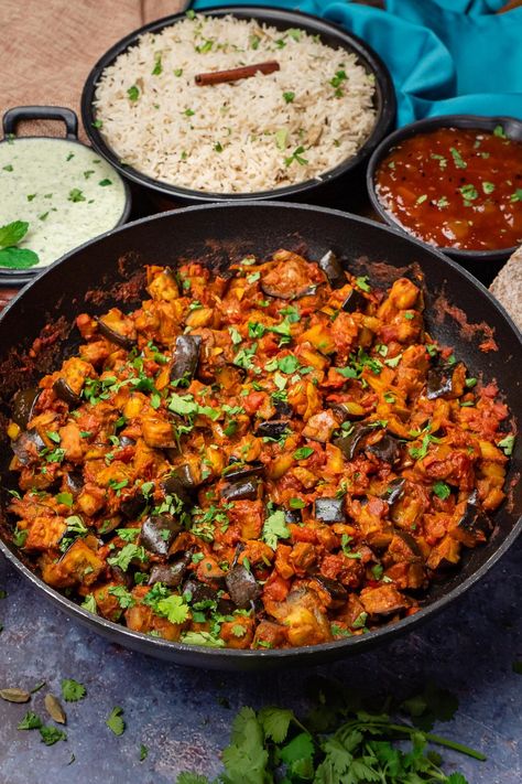 Looking for a delicious, vegetarian recipe that the whole family will love? Look no further than our Brinjal Bhaji Recipe! This popular Indian dish is perfect for a quick and easy weeknight meal. This aubergine curry is packed with healthy ingredients like eggplant, tomatoes, onions, and spices, and can be served with rice or bread. You can make it as spicy or as mild as you like, depending on your preference. So why not give it a try tonight? Aubergine Recipe Indian, Indian Aubergine Recipes, Aubergine Curry Indian, Aubergine Indian Recipe, Indian Brinjal Recipes, Brinjal Curry Recipes, Brinjal Bhaji, Indian Eggplant Recipes, Keto Indian Food