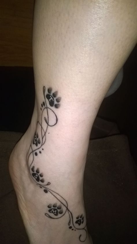 Love this paw tat for some of our beloved pets Dog Paw Tattoos For Women With Flowers, Pet Tattoos Cat Paw Prints, Paw Print Tattoo Back Of Leg, Paw Print Vine Tattoo, Dog And Cat Paw Tattoo Together, Cat Paw Print Tattoo With Flowers, Tattoo Paw, Cat Paw Tattoos, Paw Tattoos