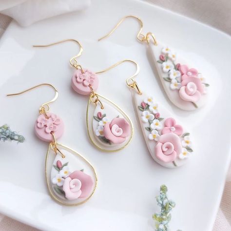 Abi_and_Clay on Instagram: "🪷Vintage style Rose and Bud teardrop earrings🪷 A very soft blush pink palette with white blossoms and a rose centrepiece, all handcrafted from polymer clay..🌸 A lovely statement piece for a spring/Summer event!!💐 . . . . . . . #roses #Spring2023 #springsummer #springseason #vintageflorals #vintagestyle #floralearrings #etsygifts #etsyireland #flowersarebeautiful #earrings2023 #earringslover #madeinireland #irishbusiness #irishartist #giftsforher #prettyearrings #l Pretty Polymer Clay Earrings, Polymer Clay And Resin Earrings, Rose Clay Earrings, Polymer Clay Wedding Earrings, Blush Pink Palette, Rose Centrepiece, Pink Clay Earrings, Rose Earring, Homemade Clay