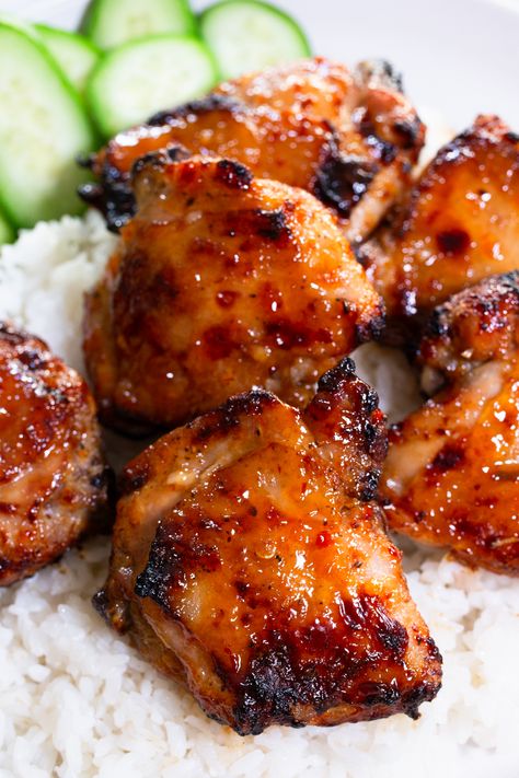 Enjoy the perfect blend of sweet and spicy with our Sticky Sweet Chili Chicken Thighs in Air Fryer recipe! Elevate your dinner game with these succulent chicken thighs, coated in a sticky and flavorful glaze. Indulge in the irresistible combination of sweet and spicy chicken, perfect for lovers of Asian-inspired cuisine. Whether you're a fan of spicy baked chicken or crave the bold flavors of spicy Korean chicken, this dish is sure to satisfy. Sweet Chili Chicken Air Fryer, Chicken Thigh Asian Recipes, Bone In Chicken Thigh Recipes Air Fryer, Air Fryer Sticky Chicken, Asian Chicken Thigh Recipes, Chinese Chicken Thigh Recipes, Saucy Chicken Recipes, Saucy Baked Chicken, Air Fryer Asian Chicken