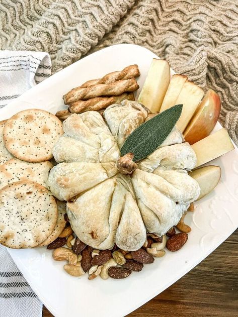 Warm and gooey pumpkin baked brie is an easy appetizer that you Baked Brie Sunflower, Pumpkin Baked Brie Puff Pastries, Apple Butter Baked Brie, Pumpkin Brie Appetizer, Pumpkin Brie Puff Pastries, Fall Baked Brie Appetizer, Fall Brie Appetizer, Brie Pumpkin, Pumpkin Baked Brie