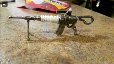 "Military grade assault spark plug" Spark Plug Crafts, Welded Ornaments, Sparkplug Art, Hardware Art, Cool Welding Projects, Recycled Metal Art, Barn Wood Projects, Scrap Art, Welding And Fabrication