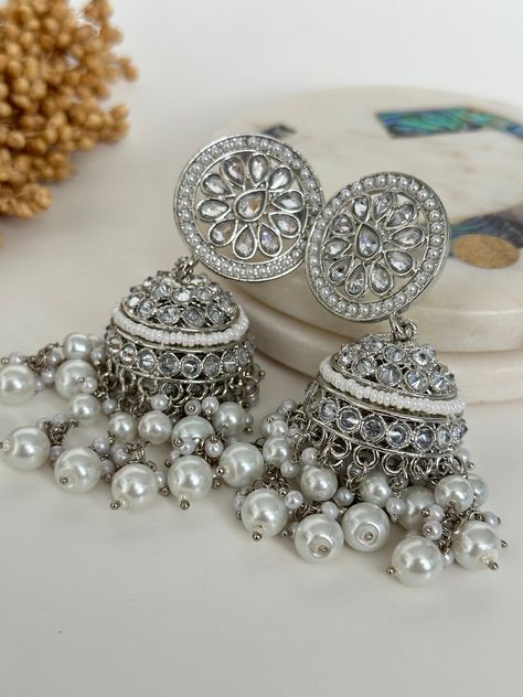 Silver Reverse american diamond jhumka. High quality polki work.  length- 2.5 inches  Style tip- Pair it with any beautiful traditional outfits  and flaunt with Unique style of collection from us. Perfect match for Festival and Traditional wear.  Take Care Tips-  Kee away from perfume, Hair spray and. Moisture.  Store in dry place , Ziplock bag or Airtight box.    Clean with dry cloth.  Jewellery is the last thing you should wear and first thing you should remove.  ------------------------------------------------ For customers outside Canada-  Some Countries apply import Duties and Taxes on goods which will be paid by customers . Please check your local regulations for more information. Cloth Jewellery, Peach Mirror, Trendy Silver Jewelry, Mirror Earrings, Pretty Jewelry Necklaces, Traditional Outfit, Fancy Jewellery Designs, Silver Statement Earrings, Ziplock Bag