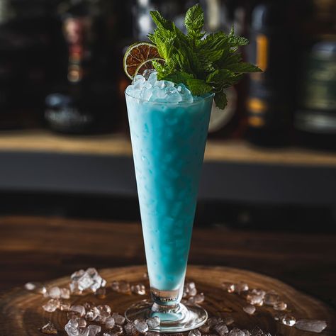 TRUE BLUE HAWAIIAN — Kō Hana Rum Infused Rum, Mint Bouquet, Happy Aloha Friday, Aloha Friday, Blue Curacao, Blue Hawaiian, Crushed Ice, Toasted Coconut, Fun Cocktails