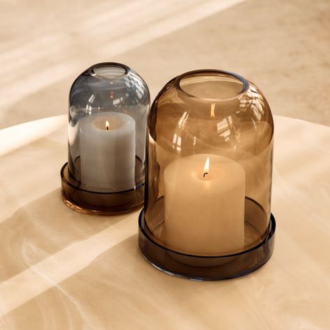 Blown-glass hurricane candle holders are captivating when illuminated. Designed to fit over a pillar candle, the cloche sits over a glass plate for an elegant, two-tone display. When lit, the opening at the top of the cloche draws the smoke upward. CB2 exclusive.  -Blown glass -Wipe with a soft cloth Zumel Round Two-Tone Glass Hurricane Candle Holder Small Cloche Candles, Candle Holder Aesthetic, Candle Case, Tv Nook, Pillar Candle Decor, House Aesthetics, Round Candle Holder, Candle Vessel, Glass Tealight Candle Holders