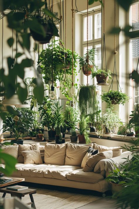 Discover the charm of indoor gardening by Styling Your Home with Hanging Plants for a refreshing and vibrant decor touch. Large Window With Plants, Hanging Plant Inspiration, Indoor Plant Design, Hanging Plants Living Room, Hanging Plants Aesthetic, Hanging Plant Aesthetic, House Plant Display Ideas, Evergreen Room, Picture Hanging Ideas