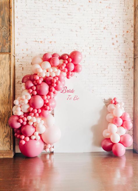 Love Is Sweet Bridal Shower Decorations, Classy Pink Bridal Shower Ideas, Bridal Shower Balloon Arch Pink, Love Themed Bridal Shower Ideas, Bridal Shower Ideas For February, Showered With Love Bridal Shower Theme, Hot Pink Bridal Shower Decorations, Valentine’s Day Bridal Shower Ideas, Pink And Red Bridal Shower Decor