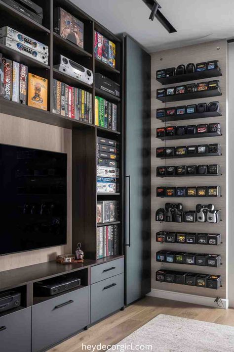 45 Super Cool Home Game Room Ideas - Hey Decor Girl [Latest Trending Decor Design Ideas] Games Console Storage Ideas, Gaming Room Storage Ideas, Closet Turned Gaming Room, Gaming Room Storage, Game Shelf Organization, Gamer Entertainment Center, Game Room Shelves, Video Game Display Ideas, Game Storage Ideas Living Room