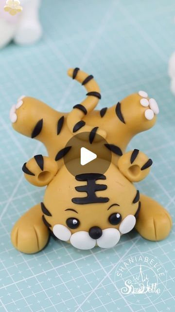 shaniabelle fondant on Instagram: "🐯How to make a tiger cake topper 🐯Gum paste from qeleg.com 🐯Feel free to contact me if you’re interested in any tools i have used.  Follow @shaniabelle_cake for more stunning cake ideas and hacks    #caketopper #tutorial #babyshowerideas  #inspirational  #genderreveal  #foodphotography #foodphotographyandstyling #reelsinstagram #foodgasm #tasty #dessert #video #inspiration #instagood #reels #cakeart #sugarart #cakeideas #LoveCelebration #BeautifulMoments #fondant #fondantcake" Tiger Fondant, Tiger Cake Topper, Tiger Cake, Fondant Figures Tutorial, Tasty Dessert, Video Inspiration, Fondant Toppers, Fondant Figures, Fimo Clay