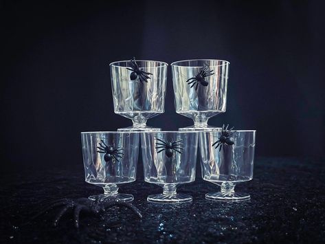 Raise your spirits with our Halloween Shot Glasses! Whether you're feeling spooky with Spider designs or going all-in with Skull glasses, these black, orange, and purple shot glasses will add the perfect eerie touch to your Halloween party.🍻 Serve up your favorite drinks in style and let the festivities begin! Perfect for themed parties or as fun table decor. Cheers to a spooky good time 🎃🍹 Spider Cocktail, Halloween Shot Glasses Diy, Spider Web Cocktail, Halloween Painted Shot Glasses, Vampire Wine Glasses, Halloween Shot Glasses, Halloween Shots, Party Serving, Cool Tables