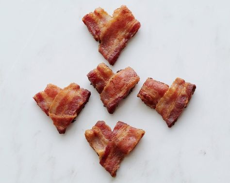 A big box of chocolates is all well and good, but nothing says "I love you" quite like a breakfast of heart-shaped bacon with eggs served in bed, or a slice of pizza with love baked into each slice. Here are 10 delicious ways to show you care. Heart Shaped Bacon, French 75 Recipe, Valentines Brunch, Foods To Make, Homemade Truffles, Heart Shaped Food, Decadent Chocolate Desserts, Valentines Day Chocolates, Box Of Chocolates