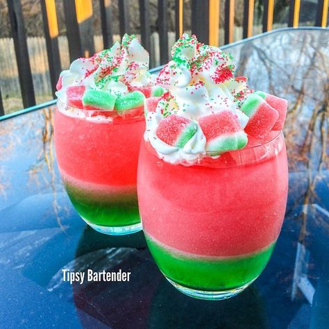 The Frozen Watermelon:  Green: Vodka Midori Sour Apple Pucker Sweet & Sour Green food coloring Ice & Blend  Pink: Vodka Watermelon Pucker Cranberry Juice Grenadine Ice & Blend  Whipped Cream Green & Pink Sugar Watermelon Wedge Gummies  INSTAGRAM PHOTO CREDIT: @letsturnup Vodka Watermelon, Sour Apple Pucker, Pink Vodka, Midori Sour, Apple Pucker, Frozen Watermelon, Candy Drinks, Tipsy Bartender, Green Food Coloring