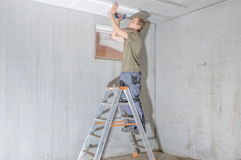 How To Update an Older Drop Ceiling | Video Home Improvement Videos, Under Deck Ceiling, Kitchen Cabinet Crown Molding, Drop Ceilings, Removing Popcorn Ceiling, Broken Concrete, Reclaimed Wood Paneling, Drop Ceiling Tiles, Alcohol Dispenser