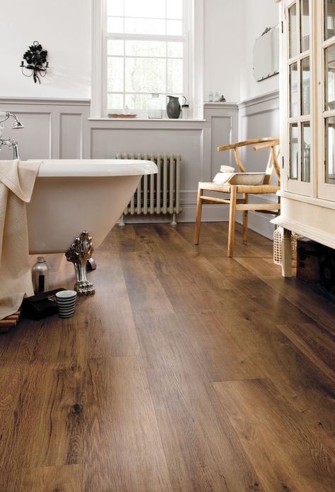 Classic Oak LVP flooring shown in a traditional-styled bathroom with claw foot tub, followed by a close-up angled image. Bathroom Flooring Trends, Wooden Bathroom Floor, Design Interior Baie, Best Bathroom Flooring, Oak Timber Flooring, Wood Floor Bathroom, Vinyl Flooring Bathroom, Vinyl Wood Flooring, Karndean Flooring