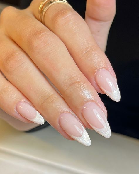 #pearlnails #frenchtipnails #frenchtipwithatwist #classynails #almondnails #biabnails #bridalnails #weddingnails #marblenails Almond Gel X French Tip, White French Tip Bridal Nails, Ivory French Tip Nails, Pearl White French Tip Nails, Pearl Tip Acrylic Nails, Elevated French Tip Nails, Bridal French Tip, White Tip Nail Ideas, Bridal Nail Ideas Brides